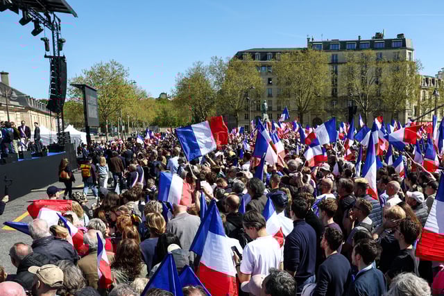 People rally in support of French far-right leader Marine Le Pen in Paris, France, on Sunday, after Le Pen's Monday embezzlement conviction resulted in her being barred from running in the country's 2027 presidential election.