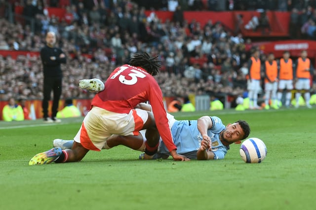 Soccer Football - Premier League - Manchester United v Manchester City - Old Trafford, Manchester, Britain - April 6, 2025  Manchester City's Matheus Nunes in action with Manchester United's Patrick Dorgu REUTERS/Peter Powell EDITORIAL USE ONLY. NO USE WITH UNAUTHORIZED AUDIO, VIDEO, DATA, FIXTURE LISTS, CLUB/LEAGUE LOGOS OR 'LIVE' SERVICES. ONLINE IN-MATCH USE LIMITED TO 120 IMAGES, NO VIDEO EMULATION. NO USE IN BETTING, GAMES OR SINGLE CLUB/LEAGUE/PLAYER PUBLICATIONS. PLEASE CONTACT YOUR ACCOUNT REPRESENTATIVE FOR FURTHER DETAILS..