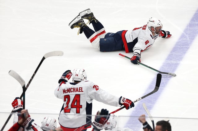 Alex Ovechkin celebrates after scoring his 895th career goal during the second period against the New York Islanders to become the NHL all-time goals leader.