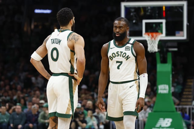 Jaylen Brown #7 of the Boston Celtics and Jayson Tatum #0 during the first quarter against the Washington Wizards at TD Garden on February 9, 2024 in Boston, Massachusetts.