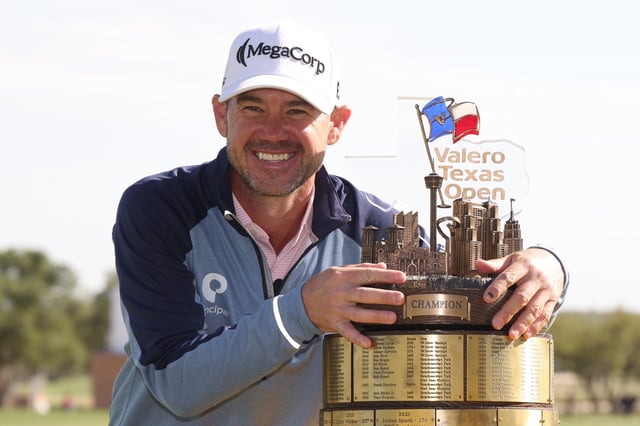 SAN ANTONIO, TEXAS - APRIL 06: Brian Harman of the United States poses with the trophy after winning the Valero Texas Open during the final round of the Valero Texas Open 2025 at TPC San Antonio on April 06, 2025 in San Antonio, Texas.