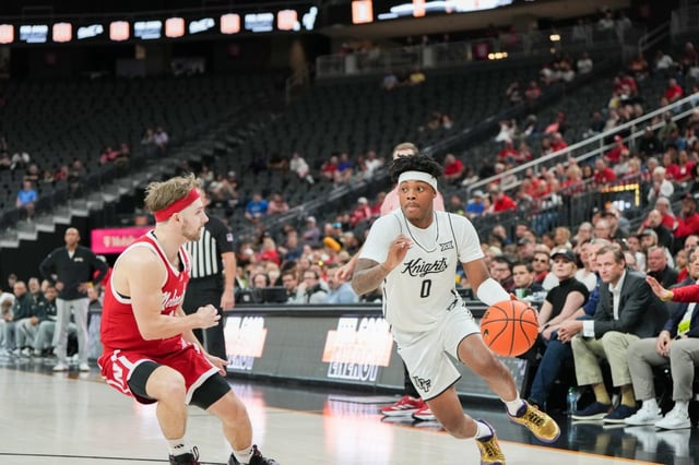 UCF guard Jordan Ivy-Curry drives past a Nebraska defender during the first half of the College Basketball Crown Tournament championship game on Sunday, April 6, 2025. (Omer Kham/FOX Sports)