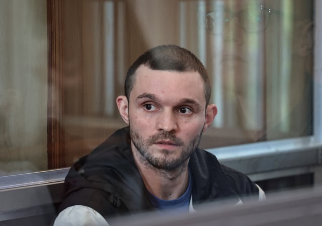Gordon Black, a U.S. Army staff sergeant, who was detained in Russia on May 2 on suspicion of stealing from a woman he was in a relationship with, appears in a court in Vladivostok, Russia, June 19, 2024. REUTERS/Tatiana Meel