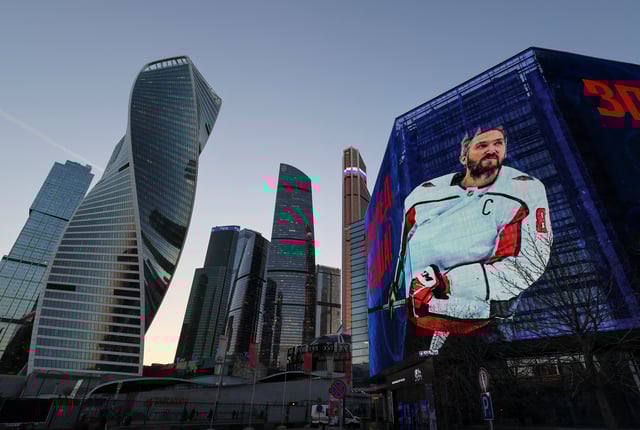 Alexander Ovechkin, the captain of the National Hockey League's Washington Capitals, is seen on a screen in support of his anticipated goals record, with backdrops of Moscow International Business District, also known as Moskva City, in Moscow, Russia April 3, 2025.  REUTERS/Shamil Zhumatov