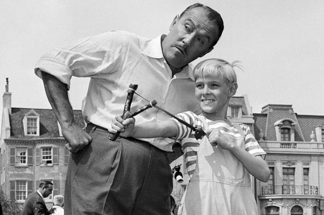 Actor Jay North, in character as Dennis the Menace, shows his ever-present slingshot to show co-star Gale Gordon, on set in Hollywood, March 29, 1962.