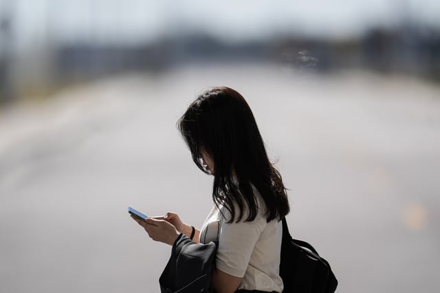 Woman on phone at the Hyundai Motor Group Metaplant America, Wednesday, March 26, 2025, in Ellabell, Ga.