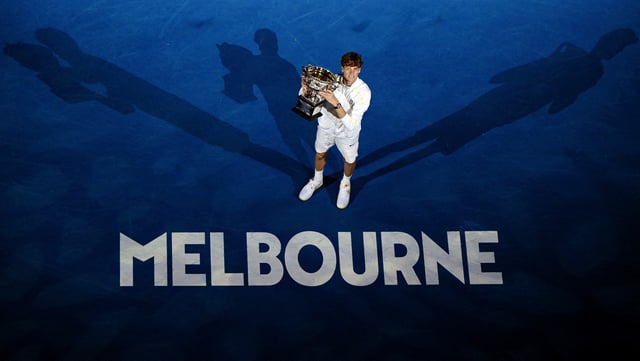 Tennis - Australian Open - Melbourne Park, Melbourne, Australia - January 26, 2025 Italy's Jannik Sinner poses with the trophy after winning the final against Germany's Alexander Zverev REUTERS/Jaimi Joy     TPX IMAGES OF THE DAY