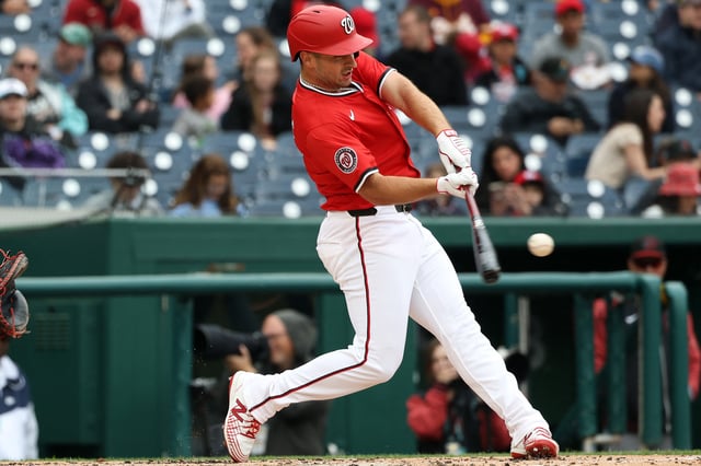 Apr 6, 2025; Washington, District of Columbia, USA; Washington Nationals shortstop Paul DeJong (14) hits a double during the second inning against the Arizona Diamondbacks at Nationals Park. Mandatory Credit: Daniel Kucin Jr.-Imagn Images