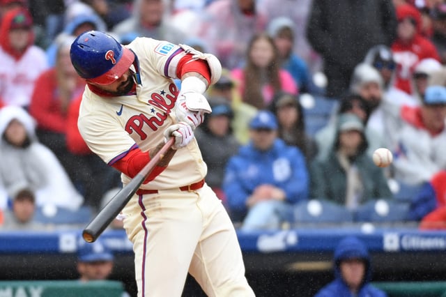 Apr 6, 2025; Philadelphia, Pennsylvania, USA; Philadelphia Phillies outfielder Nick Castellanos (8) hits a grand slam during the third inning against the Los Angeles Dodgers home run at Citizens Bank Park. Mandatory Credit: Eric Hartline-Imagn Images