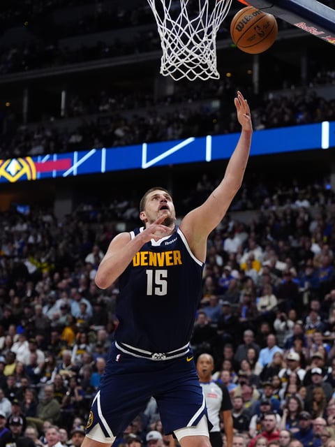 Apr 6, 2025; Denver, Colorado, USA; Denver Nuggets center Nikola Jokic (15) shoots the ball in the second half against the Indiana Pacers at Ball Arena. Mandatory Credit: Ron Chenoy-Imagn Images