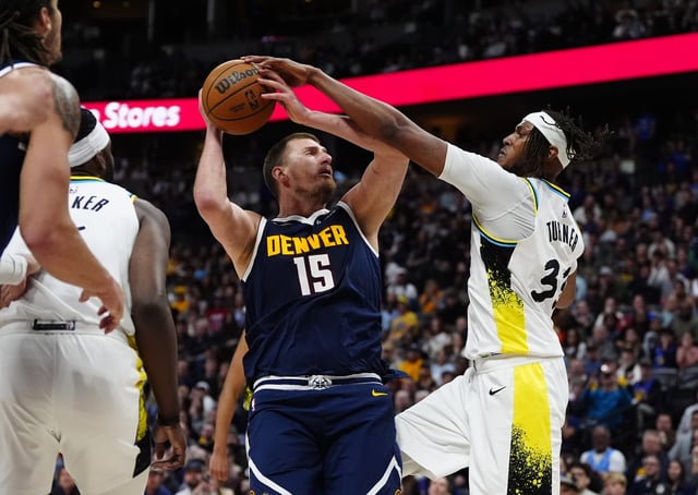 Apr 6, 2025; Denver, Colorado, USA; Indiana Pacers center Myles Turner (33) defends on Denver Nuggets center Nikola Jokic (15) in the second half at Ball Arena. Mandatory Credit: Ron Chenoy-Imagn Images
