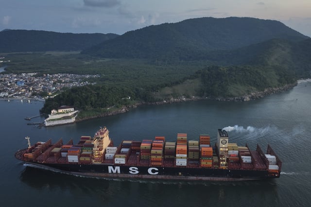 A container ship approaches the port of Santos in Brazil, Tuesday, April 1, 2025. (AP Photo/Andre Penner)