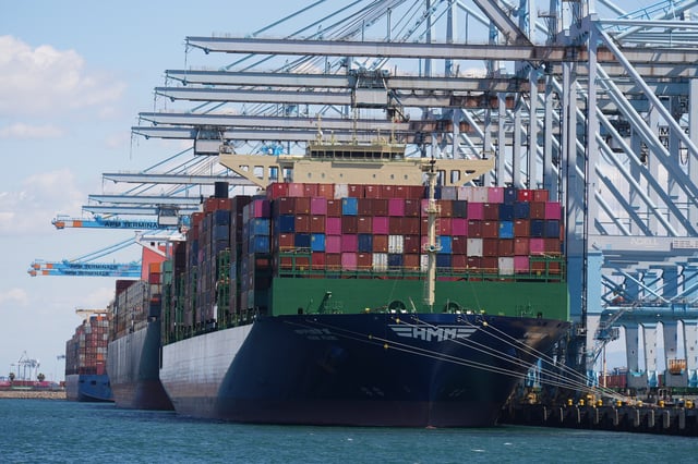 Ships are loaded at the Port of Los Angeles Wednesday, April 2, 2025, in Los Angeles. (AP Photo/Damian Dovarganes)