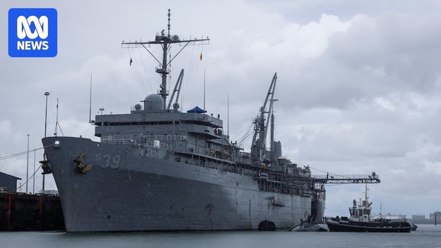 a huge ship docked in a harbour