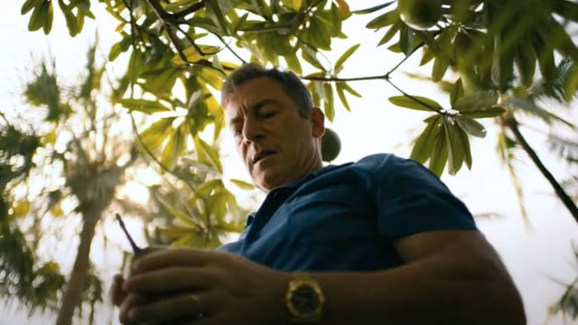 Timothy holding fruit in The White Lotus Season 3