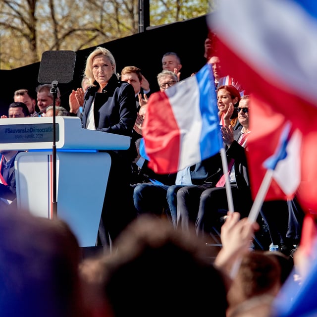 Marine Le Pen addresses a rally held in her support in Paris 