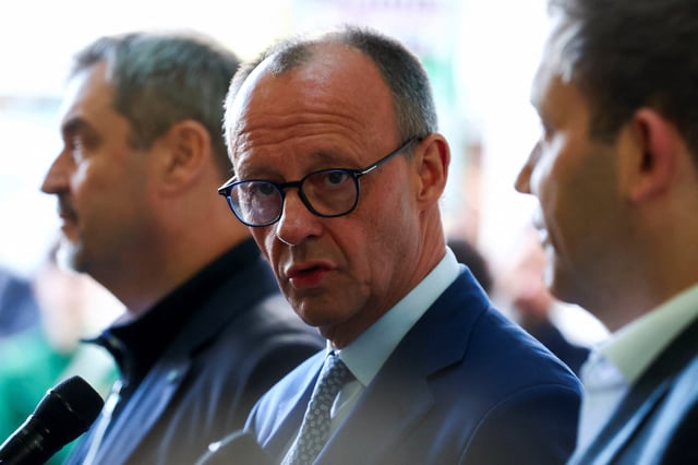 Germany's chancellor-in-waiting and leader of the Christian Democratic Union party (CDU) Friedrich Merz, gives a statement on the day Christian Democratic Union party (CDU) and Social Democratic party (SPD) have exploratory talks, in Berlin, Germany March 28, 2025. REUTERS/Christian Mang/File Photo