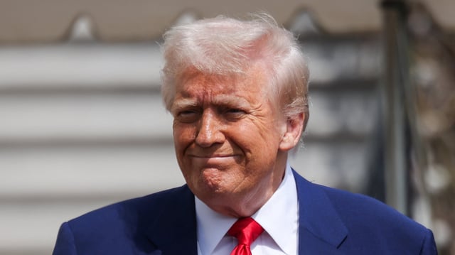 U.S. President Donald Trump boards Marine One.