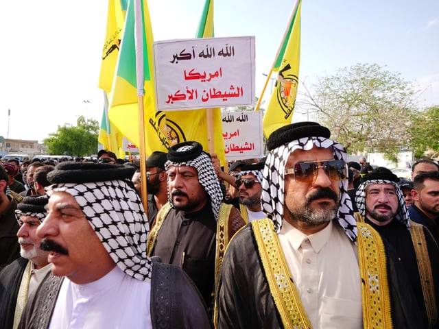 BAGHDAD, IRAQ - SEPTEMBER 22: A funeral ceremony held in the capital, Baghdad, Iraq for Abu Haidar al-Hafaji, a commander of the Iraqi Shia militia group Kata'ib Hezbollah, who was killed in an Israeli attack in Damascus, the capital of Syria, on September 22, 2024. (Photo by Murtadha Al-Sudani/Anadolu via Getty Images)