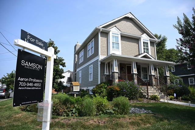 A for sale sign in front of a home in Arlington, Virginia, on August 22, 2023.