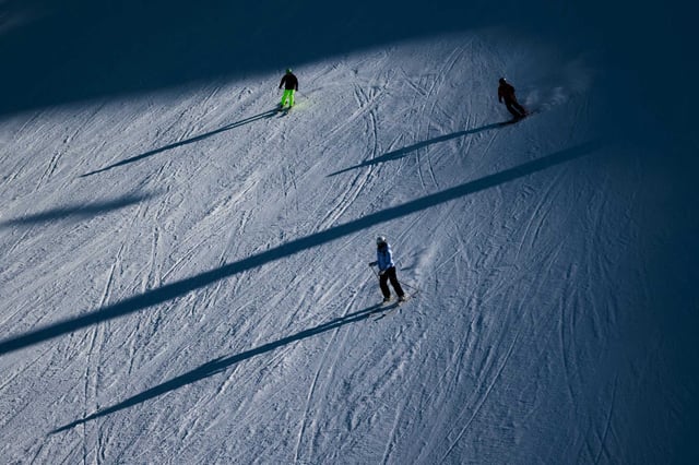 Skiers at Palisades Tahoe are seen in January. A young woman died of a head injury at the resort on Saturday.