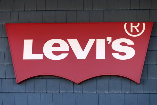 The signage of Levi Strauss & Co. store is seen at the Woodbury Common Premium Outlets in Central Valley, New York, U.S., February 15, 2022. REUTERS/Andrew Kelly/File Photo
