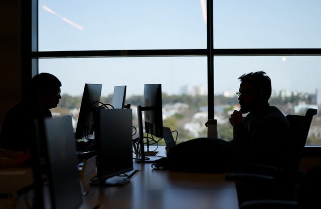 Employees of e-commerce MercadoLibre work at the company's offices in Buenos Aires, Argentina September 6, 2024. REUTERS/Agustin Marcarian/File Photo