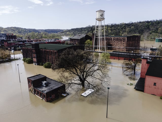 In an aerial view, the flooded Buffalo Trace Distillery is seen on Monday, April 7, 2025, in Frankfort, Ky. (AP Photo/Jon Cherry)