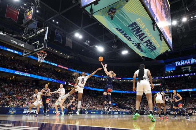 Apr 6, 2025; Tampa, FL, USA; Connecticut Huskies guard Paige Bueckers (5) shoots the ball against South Carolina Gamecocks guard Bree Hall (23) during the first half during the national championship of the women's 2025 NCAA tournament at Amalie Arena. Mandatory Credit: Nathan Ray Seebeck-Imagn Images
