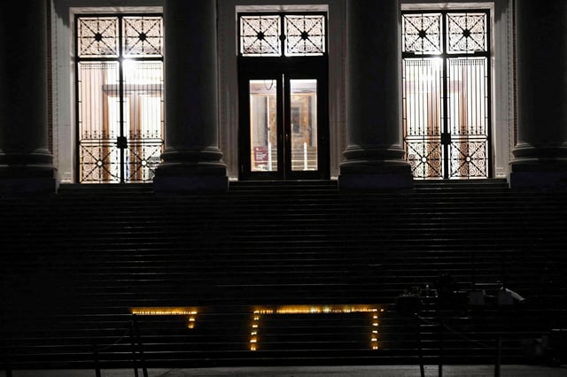 The Hebrew word "chai" (alive) is written with candles, following a vigil held on the steps of the Harry Elkins Widener Memorial Library on the one-year anniversary of Hamas' October 7 attack on Israel, to mourn those killed and to call for the release of hostages in Cambridge, Massachusetts, U.S. October 7, 2024. REUTERS/Nicholas Pfosi/File Photo