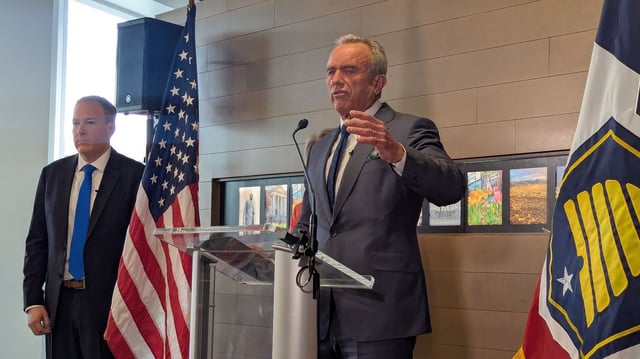 Robert F. Kennedy Jr. speaks Monday in Salt Lake City while EPA head Lee Zeldin looks on. Photo: Erin Alberty/Axios