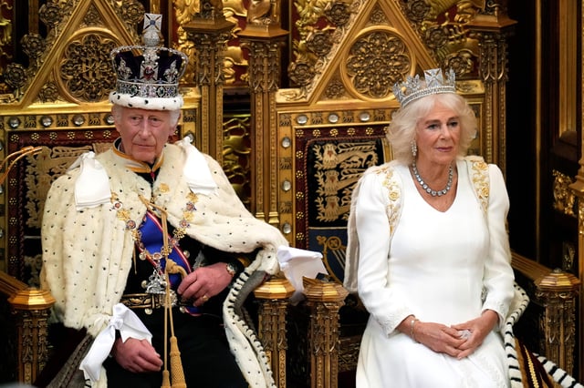 King Charles III, left, looks up as he waits to read the king's speech, as Queen Camilla sits beside him during the state opening of Parliament in the House of Lords in London on July 17, 2024.
