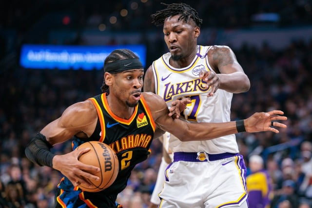 Oklahoma City Thunder star Shai Gilgeous-Alexander tries to drive around Lakers forward Dorian Finney-Smith on Sunday in Oklahoma City. The teams will square off again Tuesday night. (Photo by William Purnell/Getty Images)