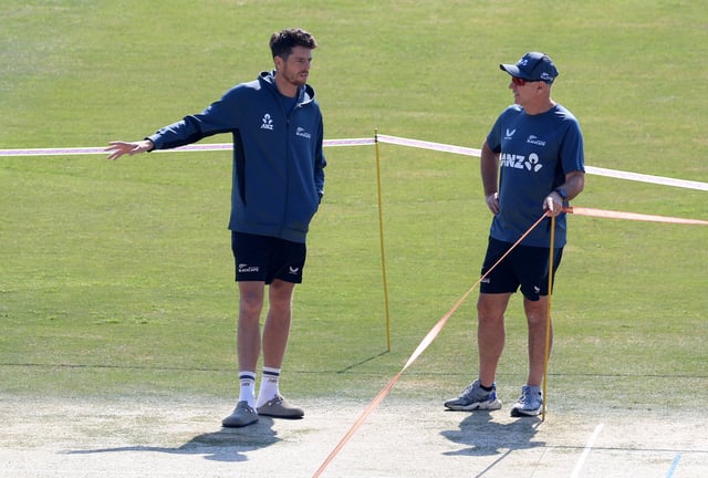 Cricket - ICC Men's Champions Trophy - New Zealand Practice - Rawalpindi Cricket Stadium, Rawalpindi, Pakistan - February 23, 2025 New Zealand's Mitchell Santner and coach Gary Stead inspect the pitch before practice REUTERS/Akhtar Soomro