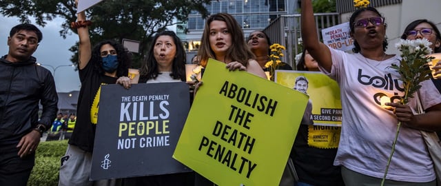 Activists attend a candlelight vigil against the impending execution of Pannir Selvam Pranthaman, sentenced to death for drug trafficking into Singapore, outside the Singaporean embassy in Kuala Lumpur, Malaysia, on February 19, 2025.