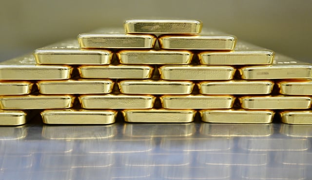 Gold bars are stacked in the safe deposit boxes room of the Pro Aurum gold house in Munich, Germany, January 10, 2025. REUTERS/Angelika Warmuth/File photo