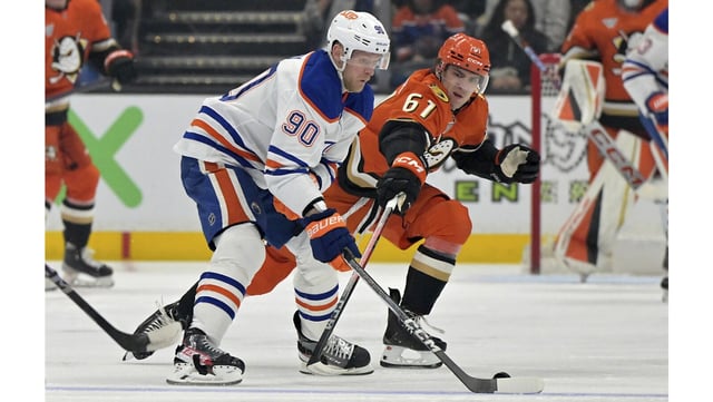 Edmonton Oilers right wing Corey Perry, left, and Ducks left wing Cutter Gauthier vie for the puck during the first period on Monday night at Honda Center. Gauthier scored two goals in a 3-2 win. (AP Photo/Jayne Kamin-Oncea)