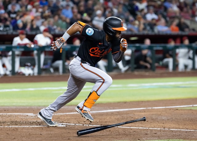 Apr 7, 2025; Phoenix, Arizona, USA; Baltimore Orioles outfielder Cedric Mullins drives in a run in the fourth inning against the Arizona Diamondbacks at Chase Field. Mandatory Credit: Mark J. Rebilas-Imagn Images