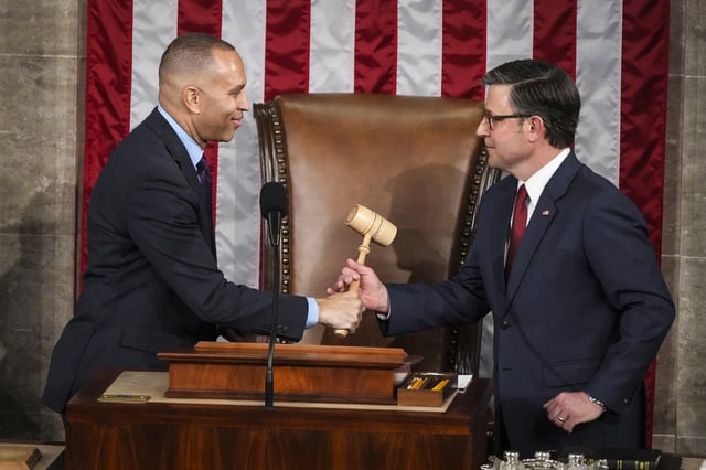 House Minority Leader Hakeem Jeffries, D-N.Y., left, hands the gavel to House Speaker Mike Johnson, R-La., in a customary nod to the peaceful transfer of power as the House of Representatives meets to elect a speaker and convene the new 119th Congress at the Capitol on Jan. 3, 2025. 
