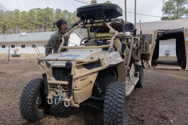 Military specialists test a Kymeta satellite terminal attached to a command-and-control all-terrain tactical vehicle during an exercise at Fort Barfoot, Virginia. Credit: U.S. Marine Corps photo by Pfc. Christian Alston