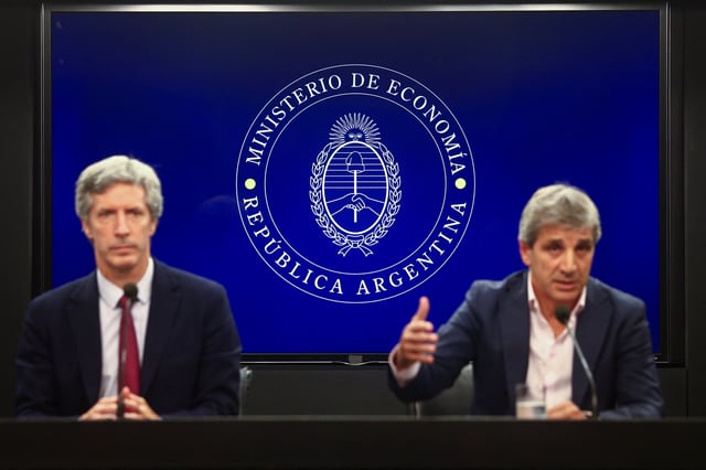 Argentina's Economy Minister Luis Caputo and Central Bank's President Santiago Bausili attend a press conference following a staff-level agreement with the International Monetary Fund (IMF) on the latest review of the country's $44 billion debt program, at the Economy Ministry building in Buenos Aires, Argentina, January 10, 2024. REUTERS/Matias Baglietto/File Photo