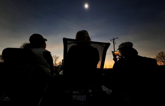 Spectators take in the April 2024 total solar eclipse from the former Ohio State Reformatory in Mansfield, Ohio.