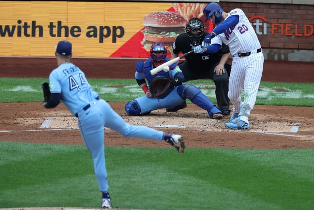 NEW YORK, NEW YORK - APRIL 06: Pete Alonso #20 of the New York Mets singles in a run in the fourth inning against Bowden Francis #44 of the Toronto Blue Jays during their game at Citi Field on April 06, 2025 in New York City.