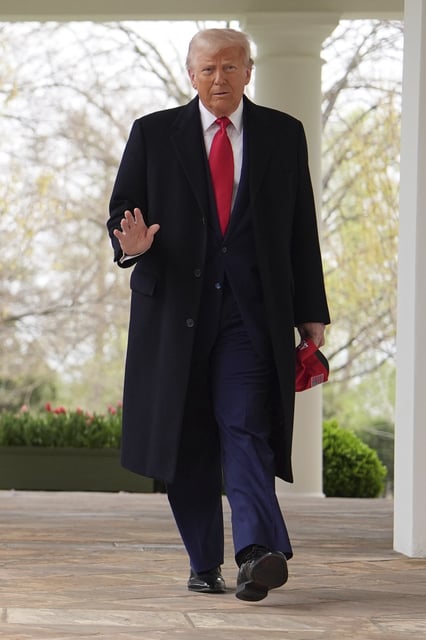 President Donald Trump walks from the Oval Office to speak at an event to announce new tariffs in the Rose Garden of the White House, Wednesday, April 2, 2025, in Washington. (AP Photo/Evan Vucci)