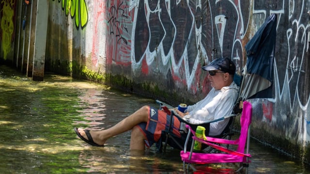 TOPSHOT - Residents cool off at Barton Creek on June 27, 2023 in Austin, Texas.