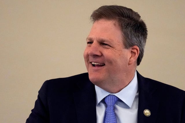 New Hampshire Governor Chris Sununu laughs during his State of the State address at the State House, Thursday, Feb. 15, 2024, in Concord, New Hampshire.