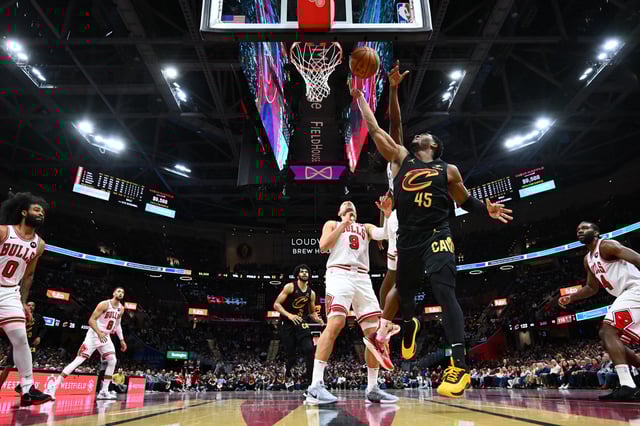Donovan Mitchell #45 of the Cleveland Cavaliers shoots over Ayo Dosunmu #11 of the Chicago Bulls during the fourth quarter of the Emirates NBA Cup game at Rocket Mortgage Fieldhouse on November 15, 2024 in Cleveland, Ohio. The Cavaliers defeated the Bulls 144-126.