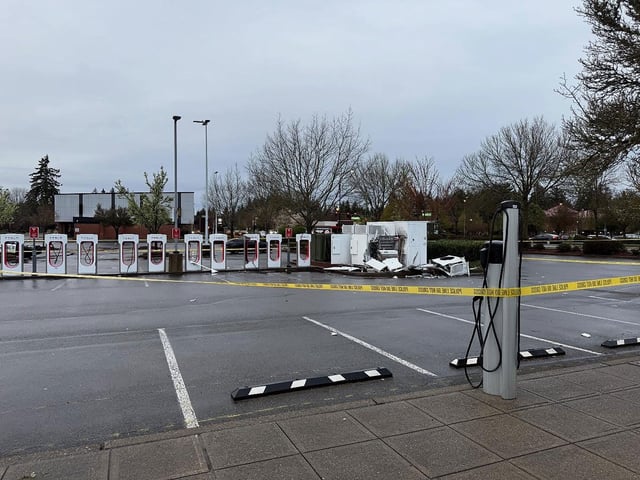 This photo from the Lacey Police Department shows a damaged Tesla charging station in Lacey, WA.
