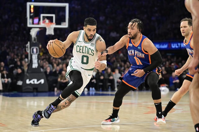 Jayson Tatum #0 of the Boston Celtics is defended by Jalen Brunson #11 of the New York Knicks during the game at Madison Square Garden on February 24, 2024 in New York City.