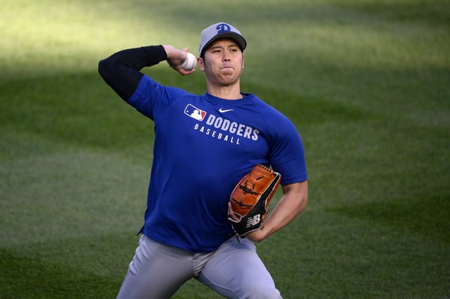 Dodgers star Shohei Ohtani works out before a game against the Washington Nationals on Tuesday, April 8, 2025, in Washington. (AP Photo/Nick Wass)